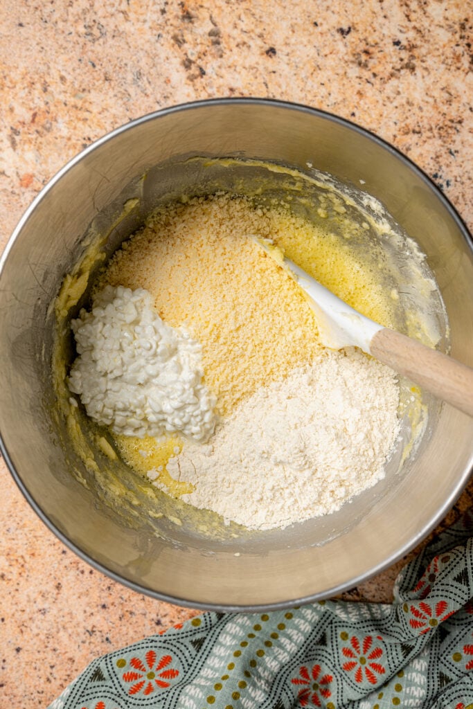 Adding the dry mixture into the creamed butter. 