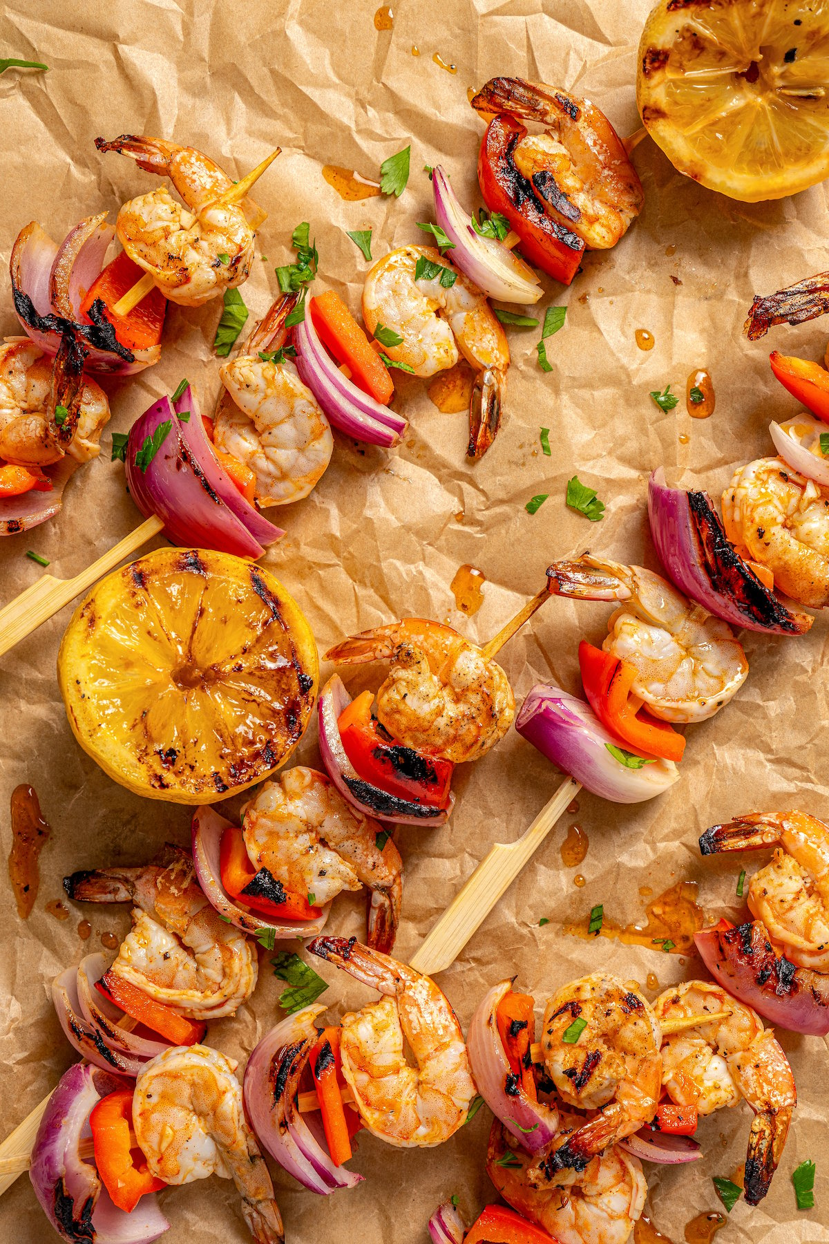 Grilled brochettes with shrimp and veggies on a piece of parchment. 